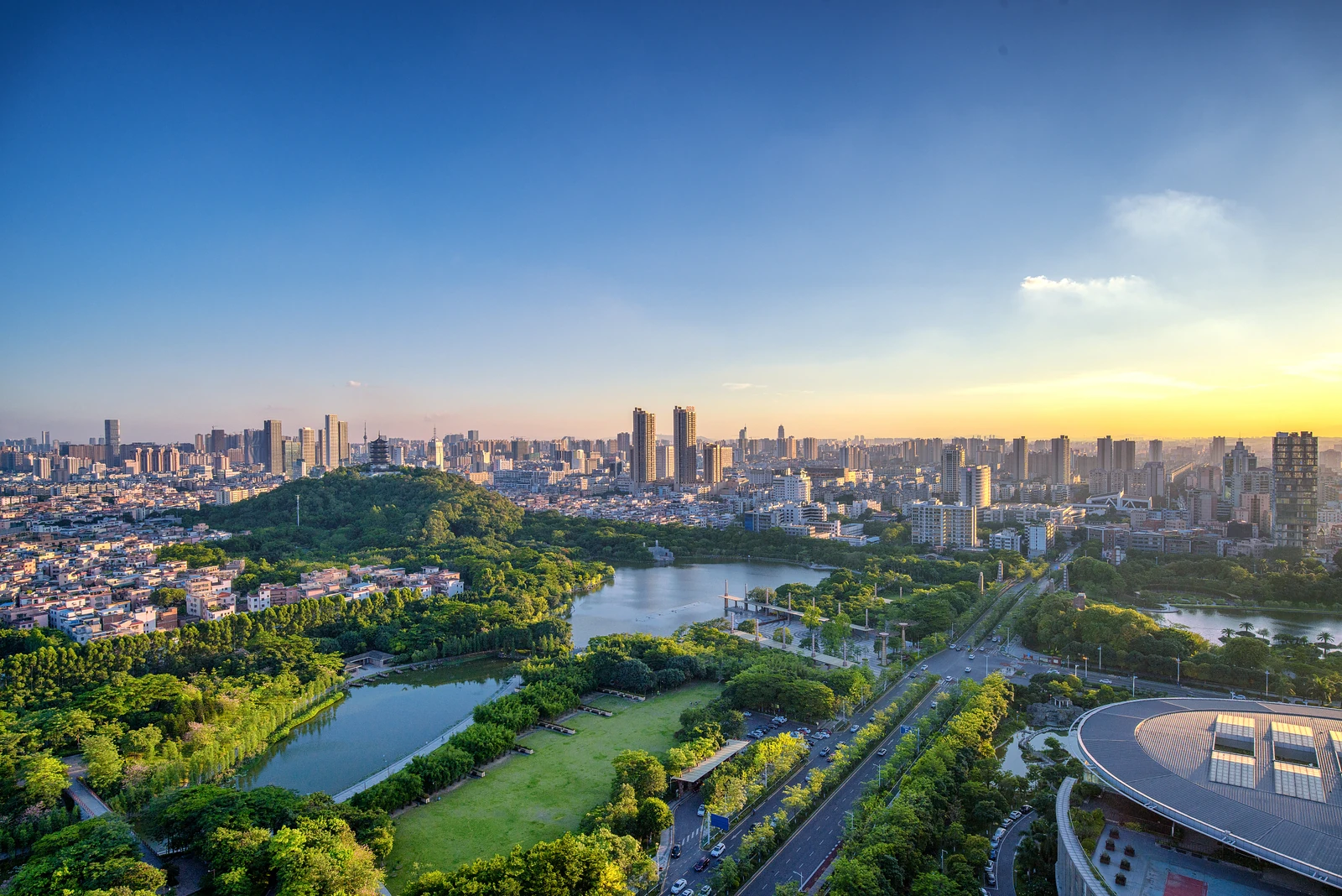 Kunming skyline with a lake, green park and evening sky